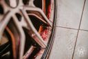 Wheel Cleaner Bleeding – Close-up of large alloy wheel spokes showing dark brown-red brake dust and iron contamination before treatment | Car Detailing | miio Store