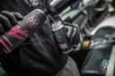 Alcantara Cleaner – Black-gloved hands spraying product directly onto dark alcantara car interior trim | Car Interior | miio Store