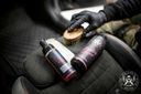 Alcantara Cleaner – Gloved hand holding bottle and round brush, ready to clean dark car interior alcantara surfaces | Car Interior | miio Store
