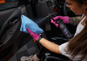 Inside Cleaner Boy – Person wearing pink gloves using blue microfibre cloth to detail car interior door panel | Car Interior | miio Store