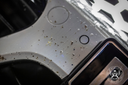 Bug Remover 1L – Close-up of grey car bonnet surface showing dried insect impact marks before treatment | Car Detailing | miio Store
