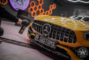 Bug Remover 1L – Yellow Mercedes-AMG GT in professional detailing studio with hexagonal lighting, ready for bug removal treatment | Car Detailing | miio Store